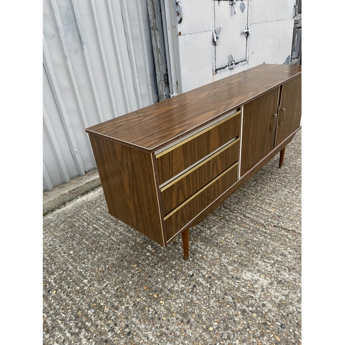 208 - A mid century formica sideboard