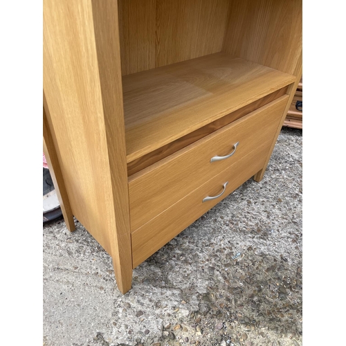 211 - A modern light oak bookcase with two drawers