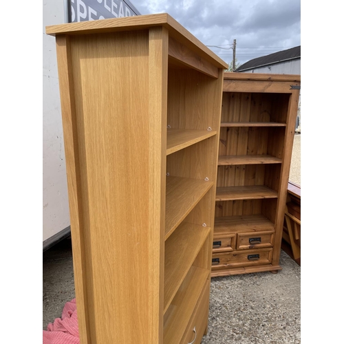 211 - A modern light oak bookcase with two drawers