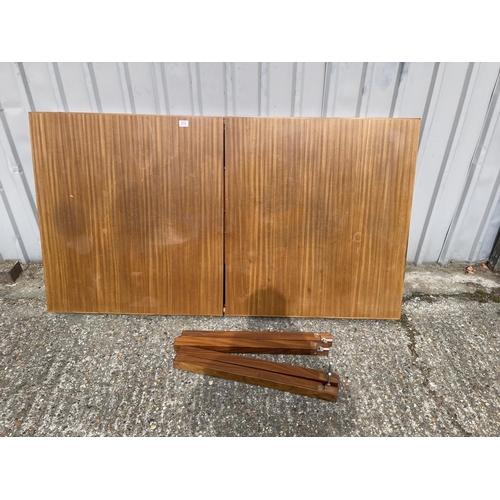 212 - A mid century teak extending table