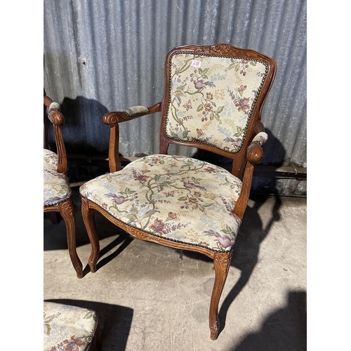 230 - A pair of frenchnstyle elbow chairs together with a matching stool