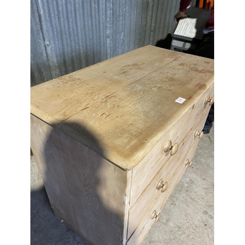 238 - A stripped pine chest of three drawers