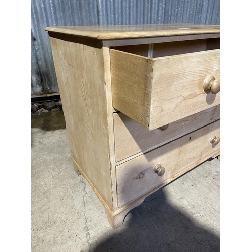 238 - A stripped pine chest of three drawers