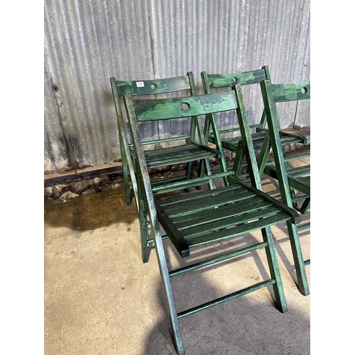 246 - Set of four green folding chairs