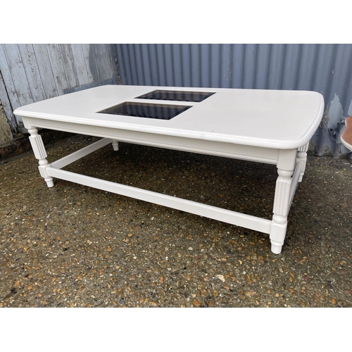 250 - A painted coffee table together with a painted swivel top sewing box