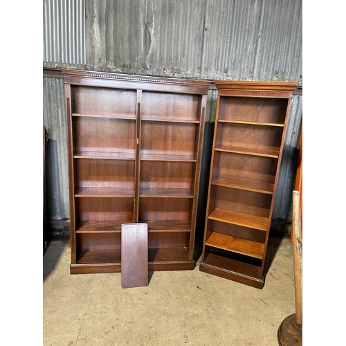 253 - A large and small pair of mahogany open fronted bookcases