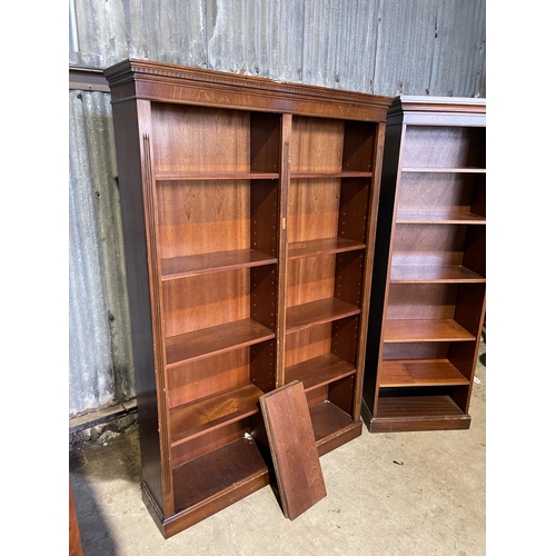 253 - A large and small pair of mahogany open fronted bookcases