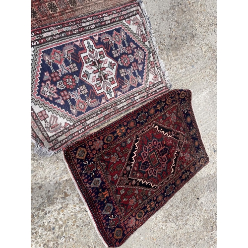 26 - Three small oriental rugs (largest 120x86)