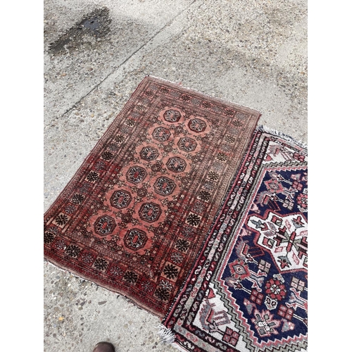 26 - Three small oriental rugs (largest 120x86)