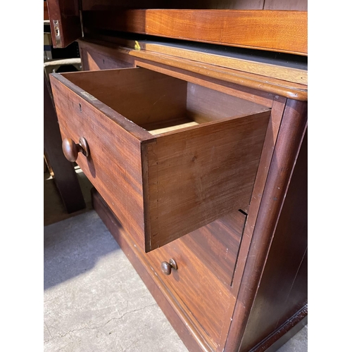 274 - A Victorian mahogany linen press, fitted with slides to the top over a four drawer base 113x50x5