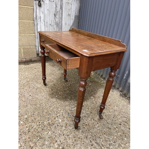 276 - A Victorian mahogany two drawer writing table