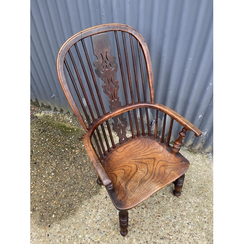 277 - A country house style antique stick back carver chair with crinoline stretcher to base