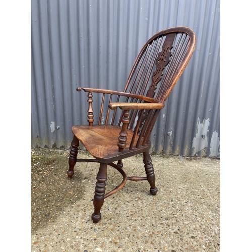 277 - A country house style antique stick back carver chair with crinoline stretcher to base