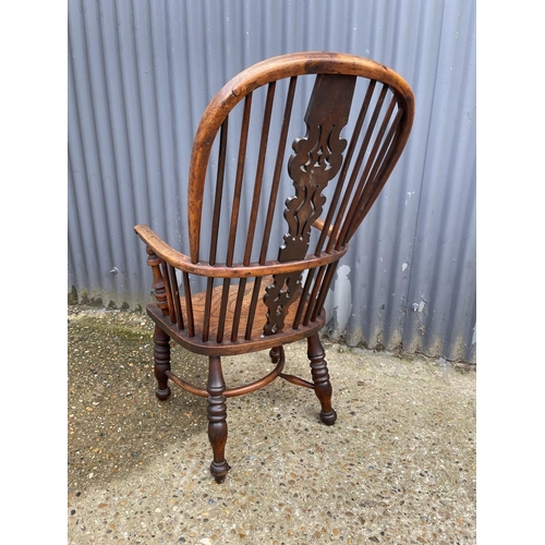 277 - A country house style antique stick back carver chair with crinoline stretcher to base