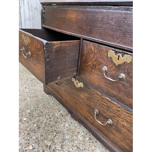 282 - A Georgian oak bureau, fitted to the interior with well. Three drawers