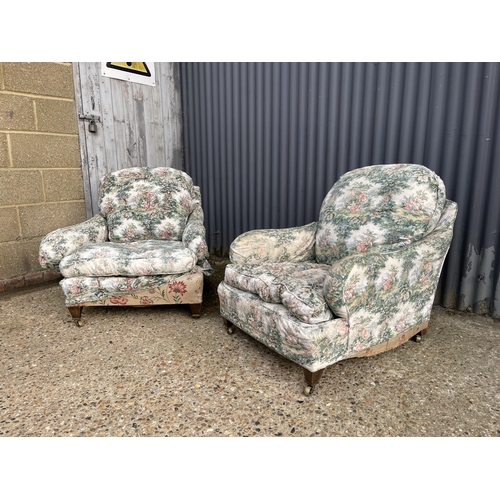 289 - A pair of deep seated country house armchairs chairs raised in square form tapering legs and brass c... 