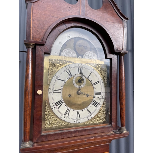 293 - An oak cased long case clock with brass dial