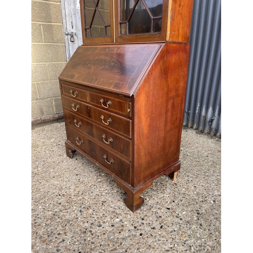 294 - A victorian mahogany bureau bookcase, glazed top with three adjustable shelves over bureau with fitt... 