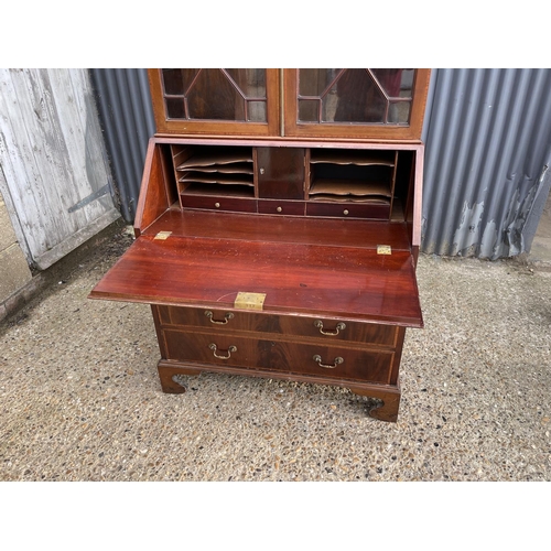 294 - A victorian mahogany bureau bookcase, glazed top with three adjustable shelves over bureau with fitt... 