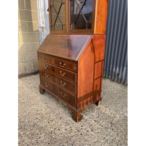 294 - A victorian mahogany bureau bookcase, glazed top with three adjustable shelves over bureau with fitt... 