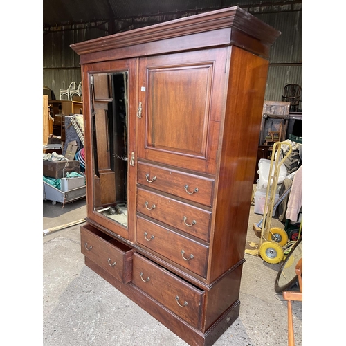 300 - An Edwardian mahogany three section compactum style wardrobe 140x47x205