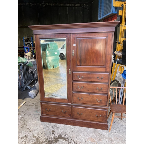 300 - An Edwardian mahogany three section compactum style wardrobe 140x47x205