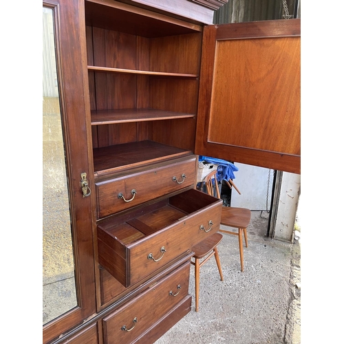 300 - An Edwardian mahogany three section compactum style wardrobe 140x47x205