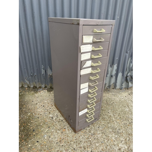 32 - A metal bank of 15 filing drawers