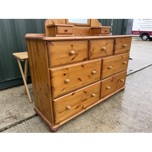 332 - A large pine multi drawer chest of drawers with detachable dressing mirror