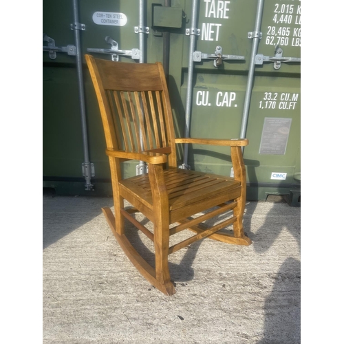 379 - A hardwood rocking chair