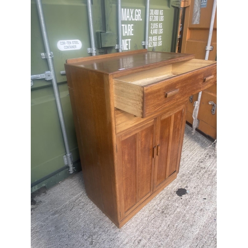 385 - A mid century oak two drawer tallboy