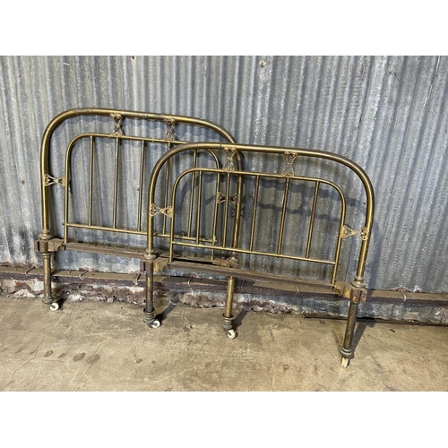 39 - A pair of vintage brass  bed ends