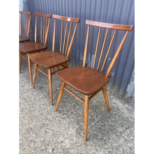 396 - A set of four ercol stick back kitchen chairs