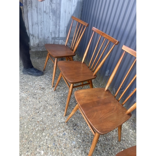 396 - A set of four ercol stick back kitchen chairs