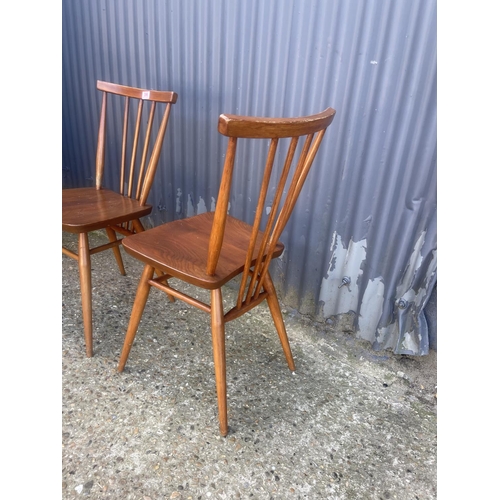 396 - A set of four ercol stick back kitchen chairs