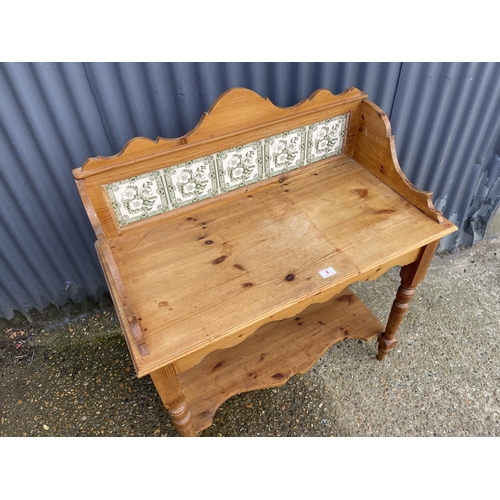 4 - A country pine washstand / side table with green pattern tile back