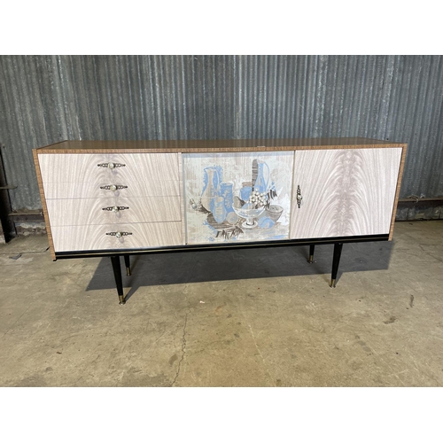 43 - A mid century formica sideboard