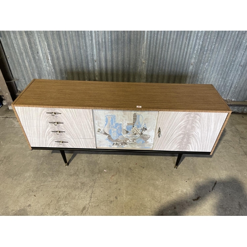 43 - A mid century formica sideboard