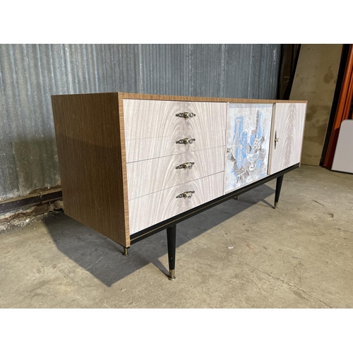 43 - A mid century formica sideboard