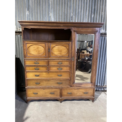 45 - A large three section compactum wardrobe labelled MAPLE & Co with linen press drawer section and mir... 