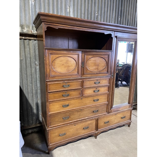 45 - A large three section compactum wardrobe labelled MAPLE & Co with linen press drawer section and mir... 