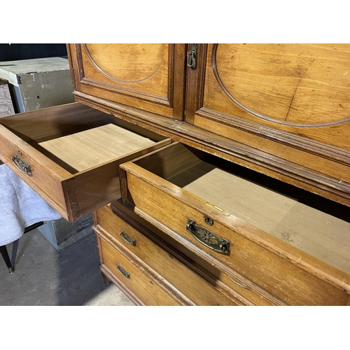 45 - A large three section compactum wardrobe labelled MAPLE & Co with linen press drawer section and mir... 