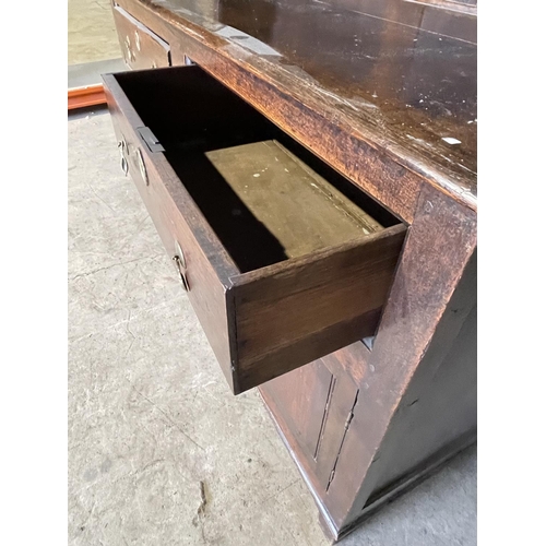 46 - An antique oak dresser with plate rack top over two drawer and three cupboard base 143x60x 195