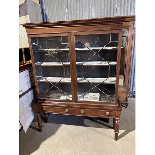 47 - A Victorian mahogany glazed bookcase on stand