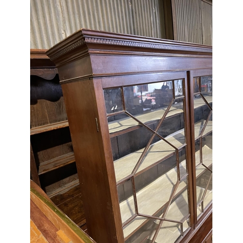 47 - A Victorian mahogany glazed bookcase on stand