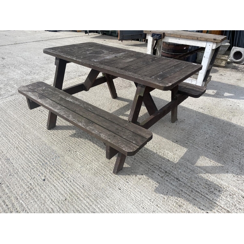 475 - A large wooden picnic bench