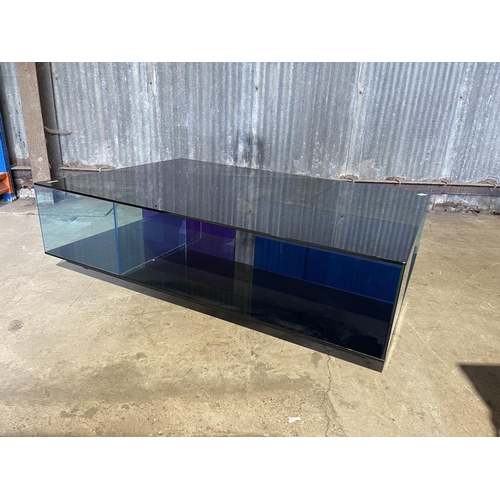 48 - A designer blue glass coffee table by NATUZZI 126x85x35