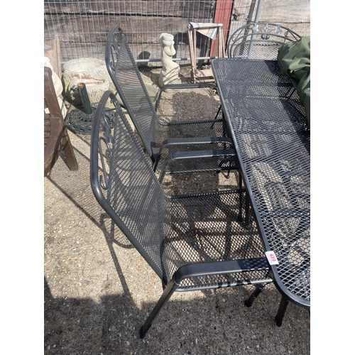 489 - A modern metal garden table and six chairs by KETLER together with umbrella and stand