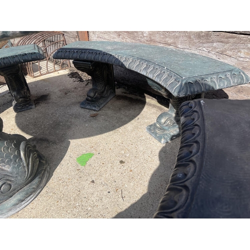 490 - A large green painted concrete circular garden table together with a set of four curved garden bench... 