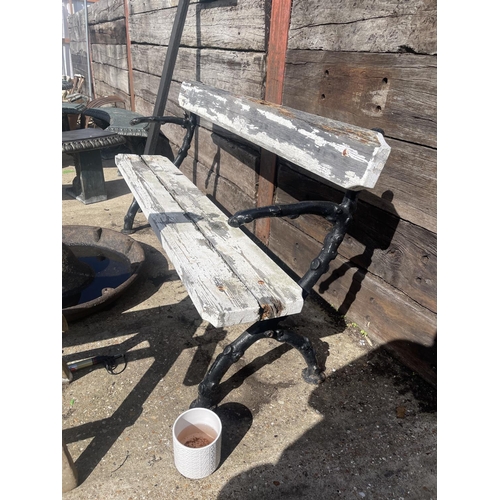 491 - A painted coalbrookdale iron framed garden bench with white painted slatted seat